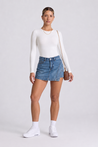 Body Manga Larga Color Blanco y Sesgo Rosado