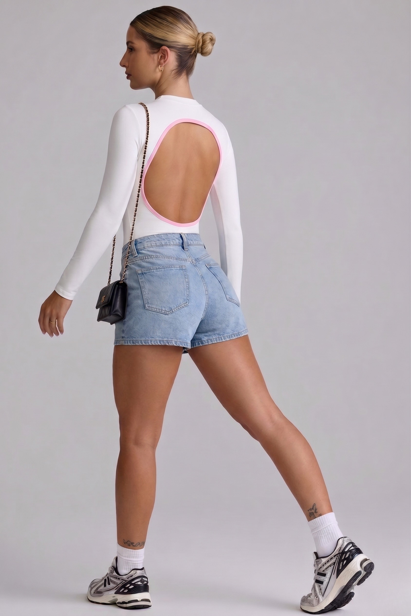 Body Manga Larga Color Blanco y Sesgo Rosado